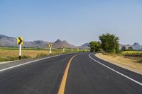 Rural Thailand Road: Yellow Field and Scenic Landscape