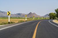 Rural Thailand Road: Yellow Field and Scenic Landscape