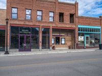 a street with some buildings next to it and the sign for weavers hairdrewhitters