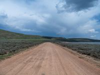 Rural Utah Landscape: Straight Road amidst Natural Beauty