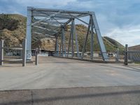 Rural Utah: A Road and Bridge Amidst Mountain and Clouds