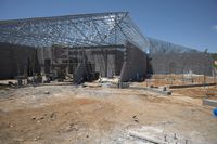 the building is covered in metal sheets to protect it from being struck by the wind