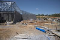 the building is covered in metal sheets to protect it from being struck by the wind
