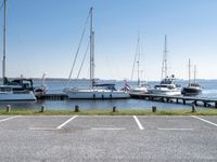 boats are parked on the shore of the harbor on an empty day next to their dock