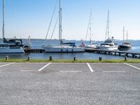 boats are parked on the shore of the harbor on an empty day next to their dock