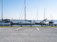 boats are parked on the shore of the harbor on an empty day next to their dock