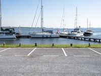 boats are parked on the shore of the harbor on an empty day next to their dock