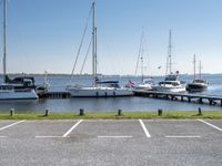 boats are parked on the shore of the harbor on an empty day next to their dock