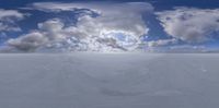 a 3d image with large cumpled clouds on top of the snow fields below the surface