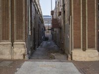 there is an old street lined with buildings and cars along the road, a tree and a city block sidewalk