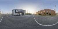 street in the city with a delivery truck and buildings as the image is 360 - fisheye