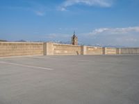 several large empty parking spaces in the city with buildings nearby in front of them -