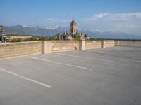 several large empty parking spaces in the city with buildings nearby in front of them -
