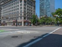 an intersection with buildings on both sides and a street light in the middle of the road