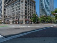 an intersection with buildings on both sides and a street light in the middle of the road