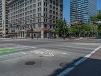 an intersection with buildings on both sides and a street light in the middle of the road