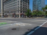 an intersection with buildings on both sides and a street light in the middle of the road