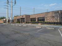 the empty street outside of the business district is empty and deserted with vehicles parked in it