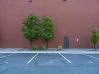 a paved street has been painted light gray, with gray brick walls and concrete edges