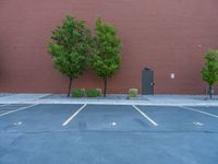 a paved street has been painted light gray, with gray brick walls and concrete edges