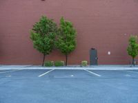 a paved street has been painted light gray, with gray brick walls and concrete edges