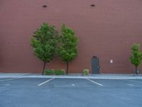 a paved street has been painted light gray, with gray brick walls and concrete edges