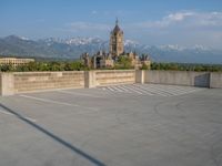 several large empty parking spaces in the city with buildings nearby in front of them -