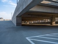 several large empty parking spaces in the city with buildings nearby in front of them -