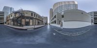 a street and a few buildings in a big city, taken 360 - shift to show movement