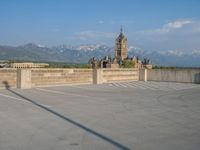 several large empty parking spaces in the city with buildings nearby in front of them -