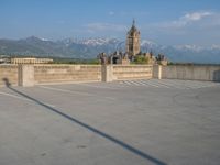 several large empty parking spaces in the city with buildings nearby in front of them -