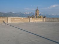 several large empty parking spaces in the city with buildings nearby in front of them -