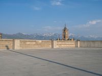 several large empty parking spaces in the city with buildings nearby in front of them -