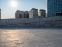 several large empty parking spaces in the city with buildings nearby in front of them -