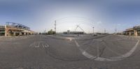 view from the front of a sports stadium in progress of parking lots in a large field