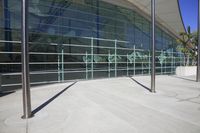 a building with glass walls and balustle balustles on it's side