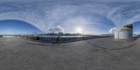 a fish eye view of a large bridge over the ocean from the side of the water