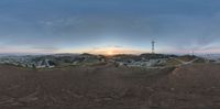 this is an panoramic picture of a city at dusk, from atop the mountain