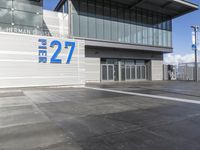 the sign reads norman cruise 377 is posted on an empty building's sidewalk