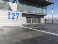 the sign reads norman cruise 377 is posted on an empty building's sidewalk
