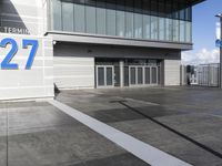the sign reads norman cruise 377 is posted on an empty building's sidewalk