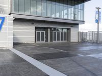 the sign reads norman cruise 377 is posted on an empty building's sidewalk