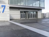the sign reads norman cruise 377 is posted on an empty building's sidewalk