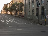 a crosswalk sign on the corner of an empty street in san francisco, california