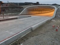 the concrete bridge is near the highway and it looks like it could be under construction