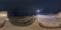 three mirrors have a man on their bike on a ramp with poles and barriers in the foreground