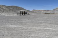 a red truck is driving through the rocky landscape of the desert of an arid area