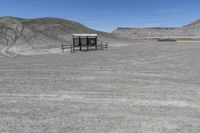 a red truck is driving through the rocky landscape of the desert of an arid area