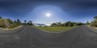 360 - generated image of a wide open beach side park road in a country setting