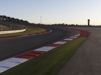 A Scenic Asphalt Road with Clear Skies: Perfect for Racing